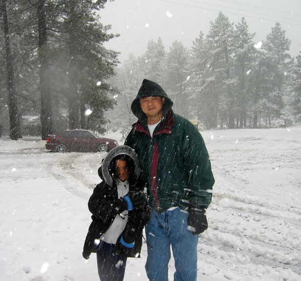 Mari and dad play in the snow!