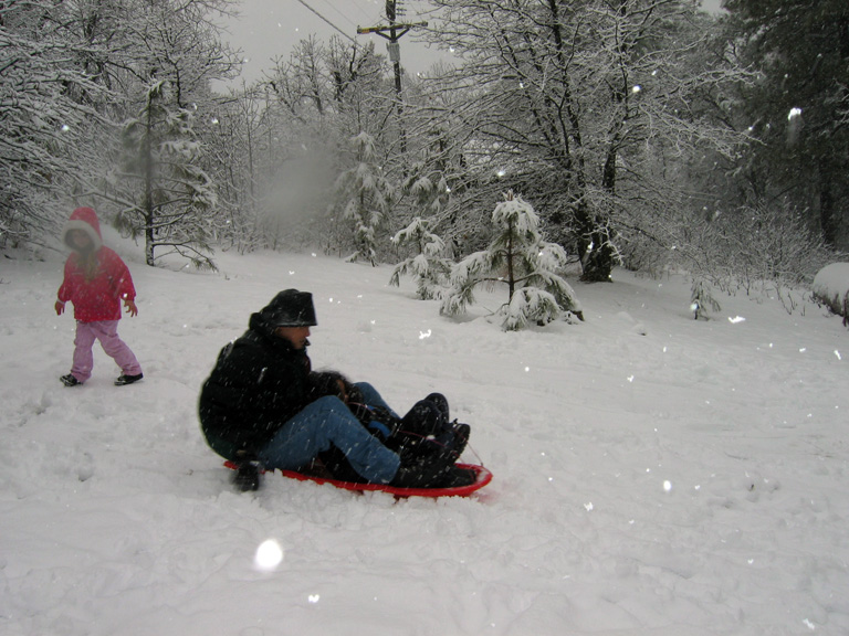 Mari and dad sled downhill!
