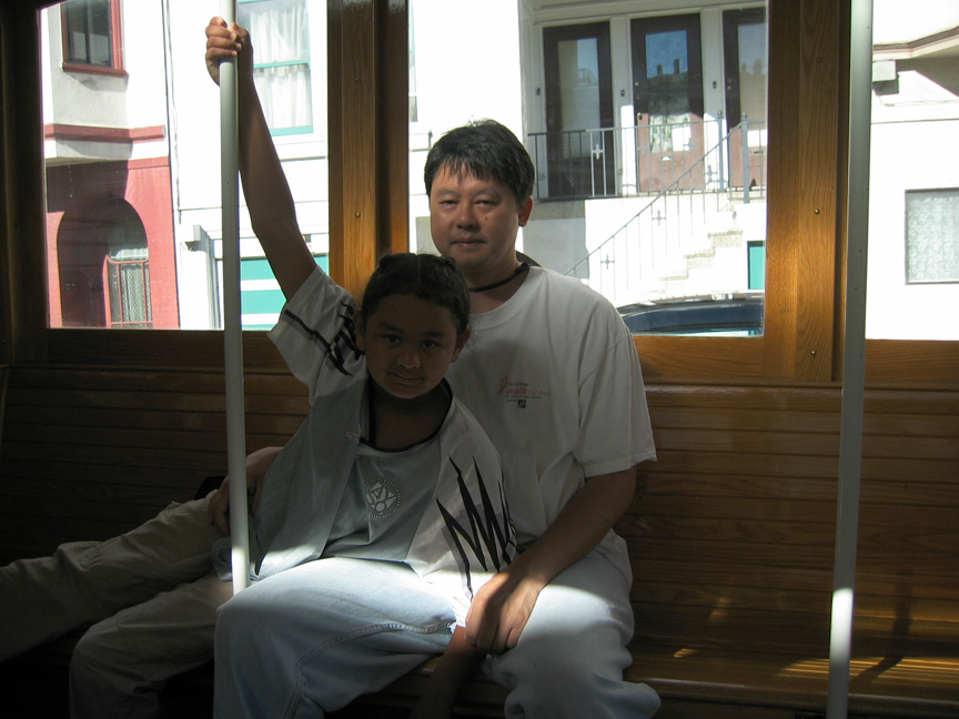 Mari rides a cable car with daddy!