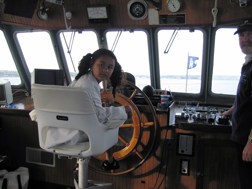 Mari helps the captain steer the ship!