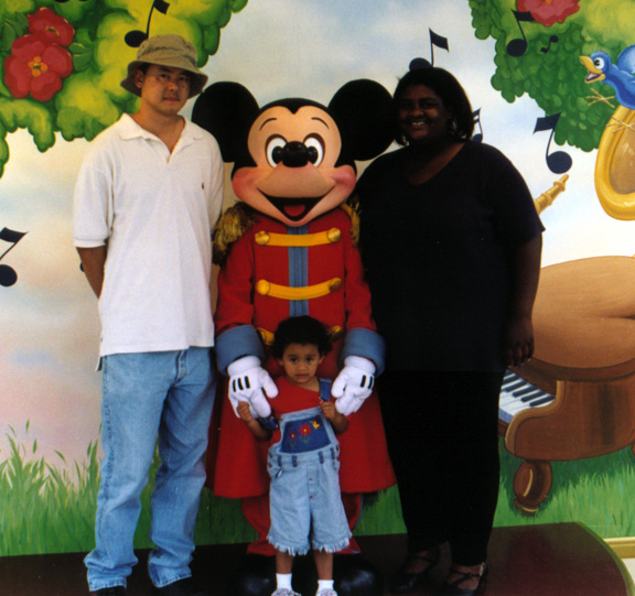 Mari, mommy, + daddy hang with Mickey!